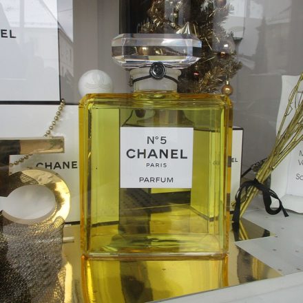 A photo of a bottle of Chanel N° 5 in a display case