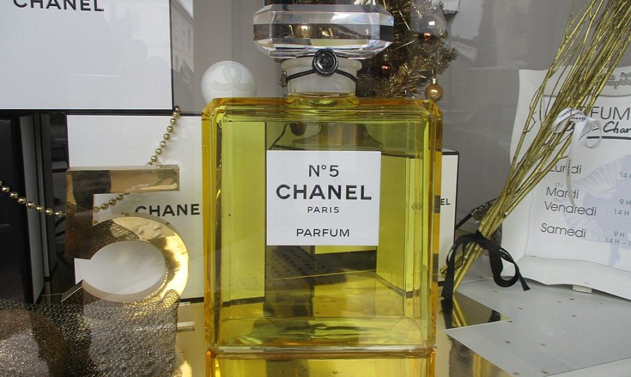 A photo of a bottle of Chanel N° 5 in a display case